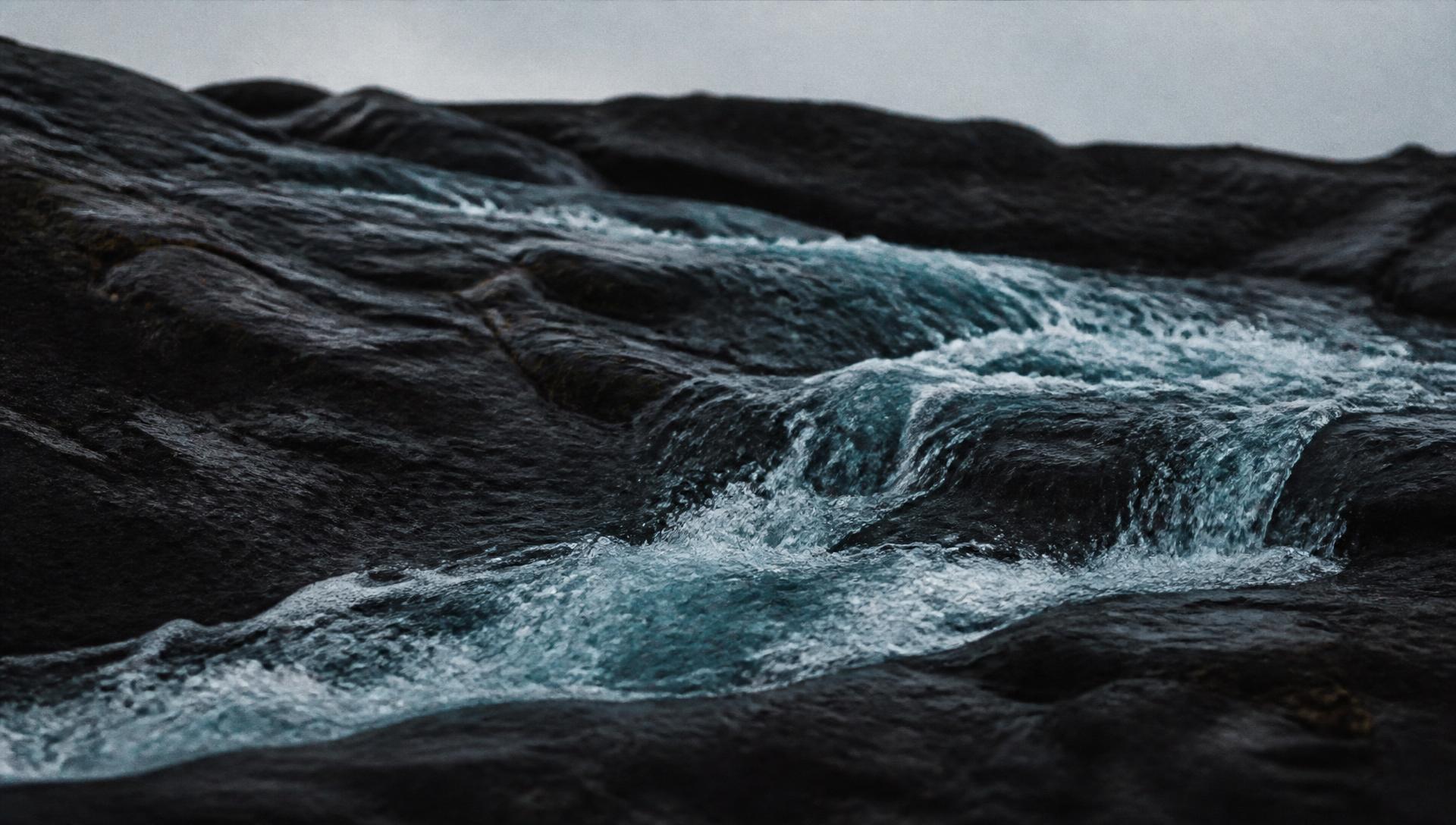 Glacial meltwater running over Icelandic basalt